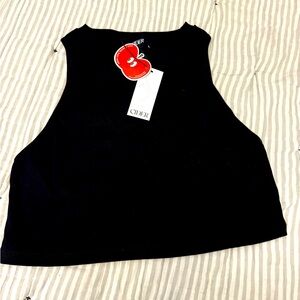 Black crop top with side ruching for a super cute fit.